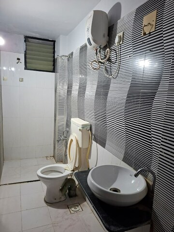 Bathroom in 3 BHK Apartment at Shree Balaji Agora Residency, Sughad – for Rent