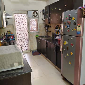 Kitchen in 2.5 BHK Apartment at Aims Golf City, Noida Central – for Sale