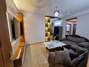 Living Room in 2 BHK Apartment at Amrapali Golf Homes, Sector 4 Greater Noida – for Rent