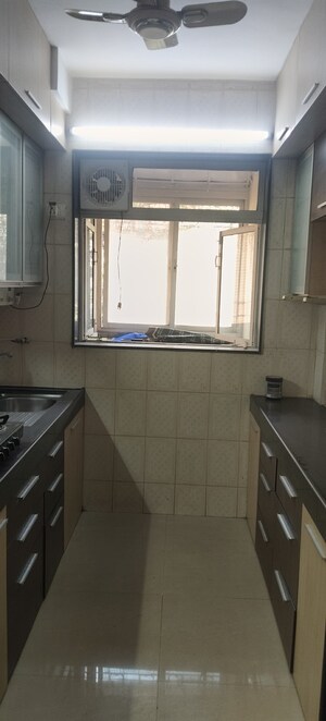 Kitchen in 1 BHK Apartment at Thakur Gayatri Satsang, Kandivali East – for Sale