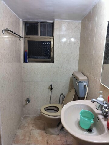 Bathroom in 2 BHK Apartment at Skylon Tower, Boat Club Road – for Rent