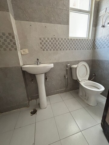 Bathroom in 2 BHK Apartment at Shri Radha Sky Gardens, Sector 16b Greater Noida – for Sale