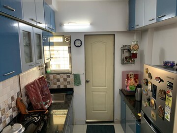 Kitchen in 1 BHK Apartment at Cosmos Orchid, Ghodbunder Road – for Sale