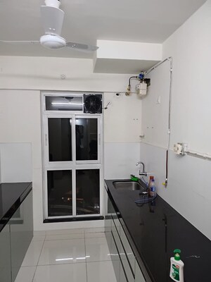Kitchen in 2 BHK Apartment at Godrej Emerald, Ghodbunder Road – for Rent
