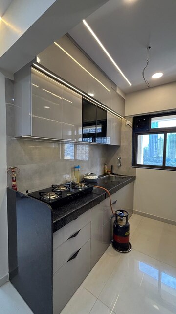 Kitchen in 1 BHK Apartment at KM Horizon Exotica, Haware City – for Rent