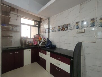 Kitchen in 1 BHK Apartment at Kanha CHS, Kopar Khairane – for Sale