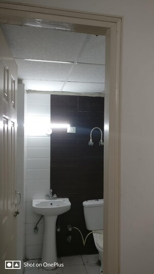 Bathroom in 3 BHK Apartment at Gulmohur Garden, Raj Nagar Extension – for Rent