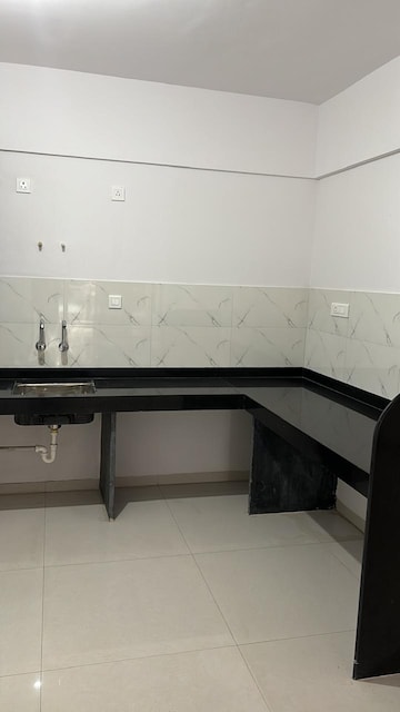Kitchen in 2 BHK Apartment at Wadgaon Sheri – for Sale