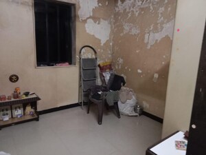 Living Room in 1 BHK Apartment at Malad SC CHS, Malad West – for Sale