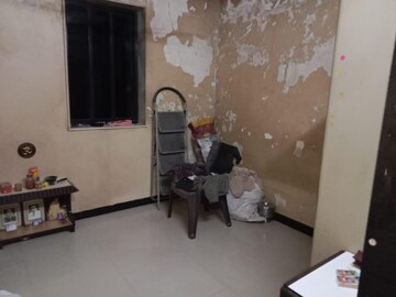 Living Room in 1 BHK Apartment at Malad SC CHS, Malad West – for Sale