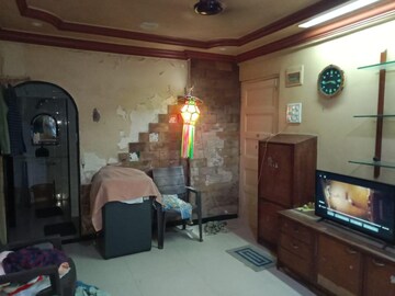 Living Room in 1 BHK Apartment at Malad SC CHS, Malad West – for Sale