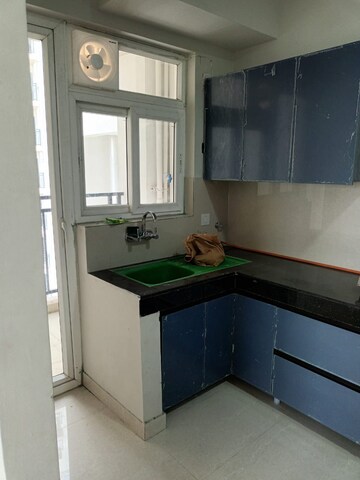 Kitchen in 2 BHK Apartment at Supertech Czar Suites, Omicron I Greater Noida – for Rent