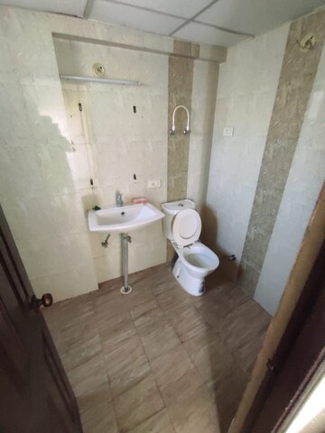 Bathroom in 3 BHK Apartment at Charms Castle, Raj Nagar Extension – for Rent