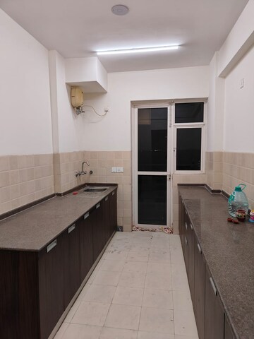 Kitchen in 4 BHK Apartment at Satya The Hermitage, Sector 103 – for Rent