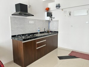 Kitchen in Studio Apartment at Gera World of Joy, Kharadi – for Rent