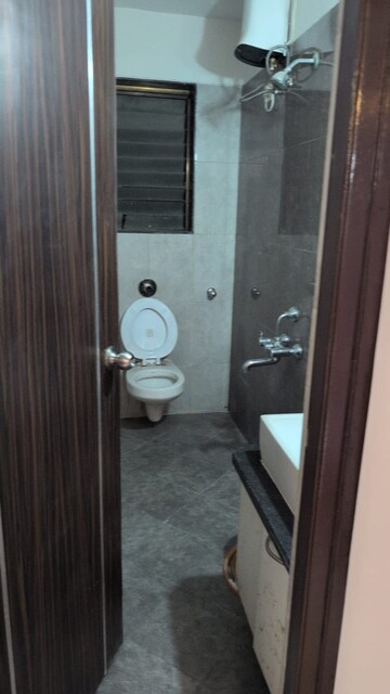 Bathroom in 2 BHK Apartment at Sudarshan Sky Garden, Ghodbunder Road – for Rent