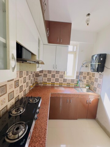 Kitchen in 2 BHK Apartment at Uninav Heights Phase I, Raj Nagar Extension – for Rent