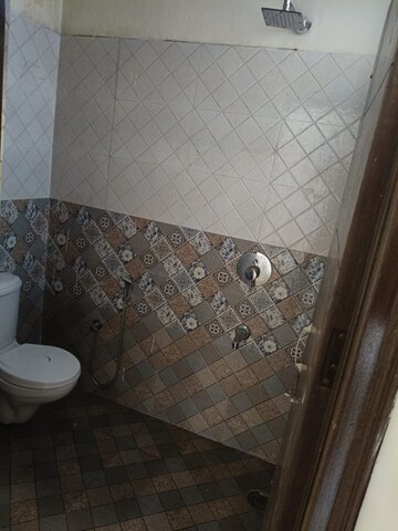 Bathroom in 3 BHK Apartment at Guru Nanak Enclave, Dhakoli – for Rent