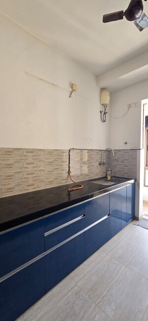 Kitchen in 3 BHK Apartment at Alkapuri Apartment, Kandivali East – for Rent