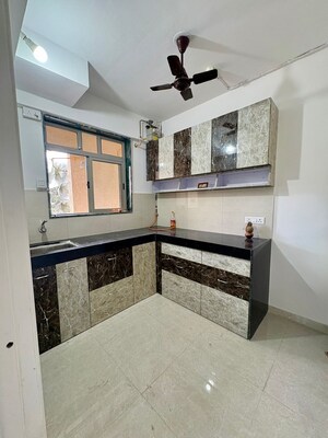 Kitchen in 1 BHK Apartment at Hiranandani Villa Grand, Ghodbunder Road – for Rent