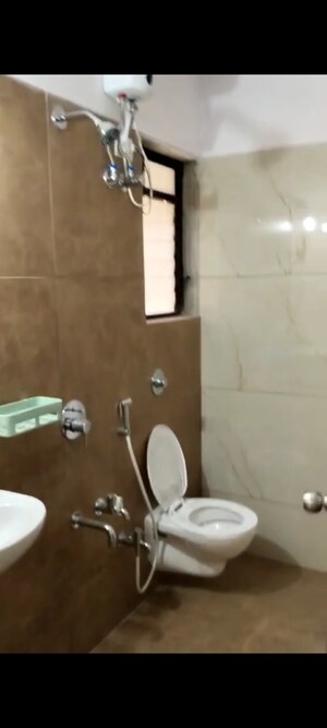 Bathroom in 1 BHK Apartment at Raunak Unnathi Woods, Ghodbunder Road – for Rent
