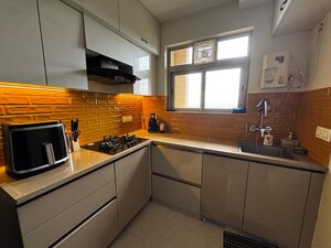 Kitchen in 1 BHK Apartment at Hiranandani Estate Solitaire C, Ghodbunder Road – for Rent