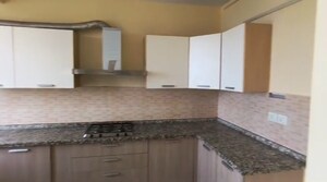 Kitchen in 3 BHK Apartment at Raheja Vedaanta, Sector 108 – for Rent