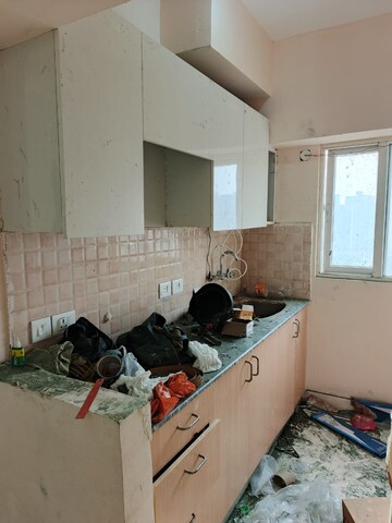 Kitchen in 2 BHK Apartment at Amrapali Golf Homes, Sector 4 Greater Noida – for Sale