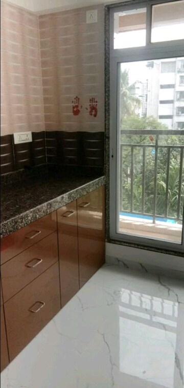 Kitchen in 1 BHK Apartment at Suvrat CHS, Tembhi Naka – for Sale