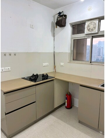 Kitchen in 1 BHK Apartment at Hiranandani Estate Solitaire C, Ghodbunder Road – for Sale