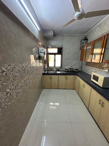 Kitchen in 1 BHK Apartment at Lokhandwala Complex – for Rent