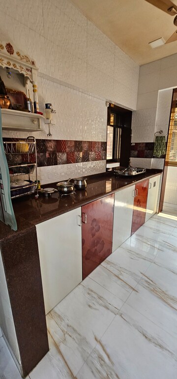 Kitchen in 2 BHK Apartment at New Gurukripa CHS, Vishnu Nagar – for Sale