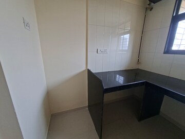 Kitchen in 1 BHK Apartment at Raunak Heights, Ghodbunder Road – for Rent