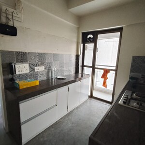 Kitchen in 2 BHK Apartment at Cosmopolis Tower, Andheri West – for Rent