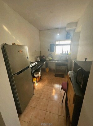 Kitchen in 2 BHK Apartment at Runwal Garden City, Balkum Pada – for Rent