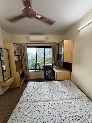 Living Room in 1 BHK Apartment at Hilton Tower, Andheri East – for Rent
