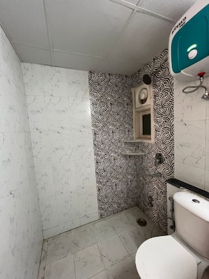 Bathroom in 3 BHK Apartment at Cosmos Express 99, Sector 99 – for Rent