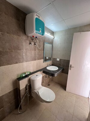 Bathroom in 3 BHK Apartment at Cosmos Express 99, Sector 99 – for Rent