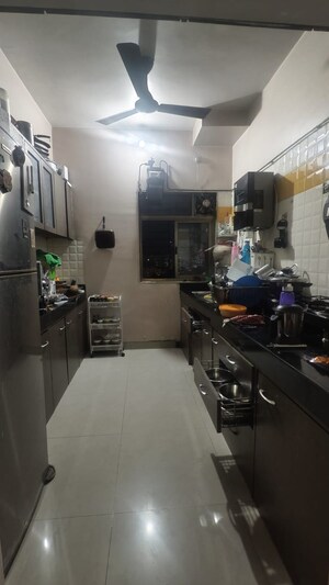 Kitchen in 2.5 BHK Apartment at Vijay Enclave, Waghbil – for Rent