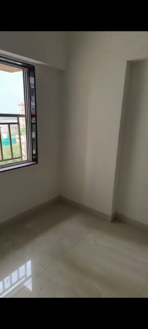 Living Room in 1 BHK Apartment at Naman Regency, Byculla – for Sale