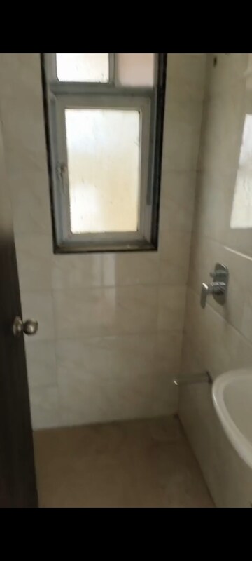 Bathroom in 1 BHK Apartment at Naman Regency, Byculla – for Sale