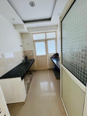 Kitchen in 3 BHK Apartment at Uninav Bliss, Raj Nagar Extension – for Rent