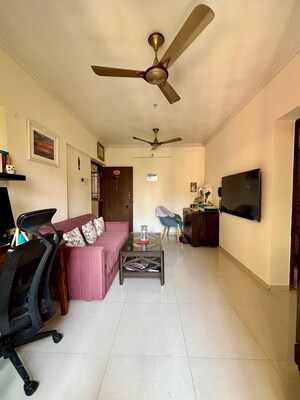 Living Room in 1 BHK Apartment at Unnati Woods CHS, Kasarvadavali – for Sale