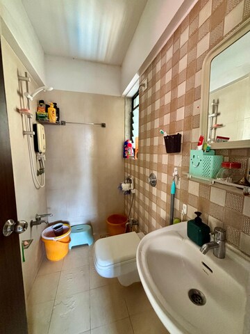 Bathroom in 1 BHK Apartment at Unnati Woods CHS, Kasarvadavali – for Sale
