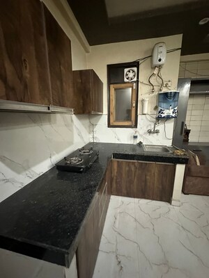 Kitchen in 2 BHK Apartment at Capital Royal Casa, Gms Road – for Rent