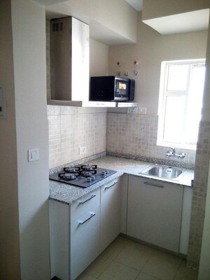 Kitchen in 1 BHK Apartment at Paras Tierea, Sector 137 – for Rent