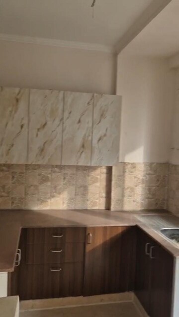 Kitchen in 2 BHK Apartment at Amrapali Golf Homes, Sector 4 Greater Noida – for Rent