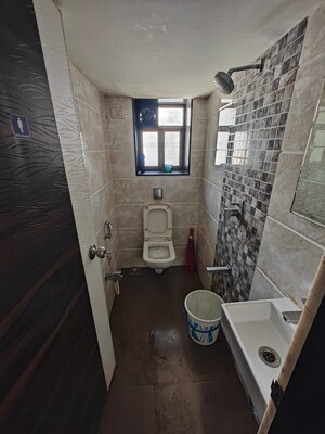 Bathroom in 2 BHK Apartment at Surya Kiran CHS, Mahim – for Rent