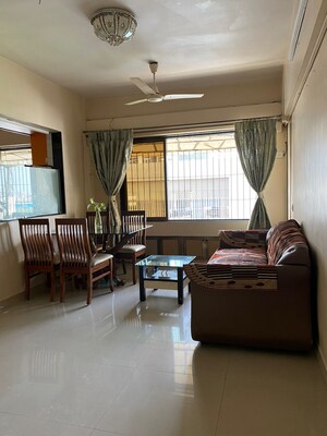 Living Room in 1 BHK Apartment at Ajmera Odyessey Apartment, Bhakti Park – for Rent
