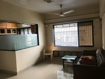 Living Room in 1 BHK Apartment at Ajmera Odyessey Apartment, Bhakti Park – for Rent